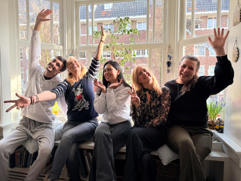 HomeVet veterinary team waving together